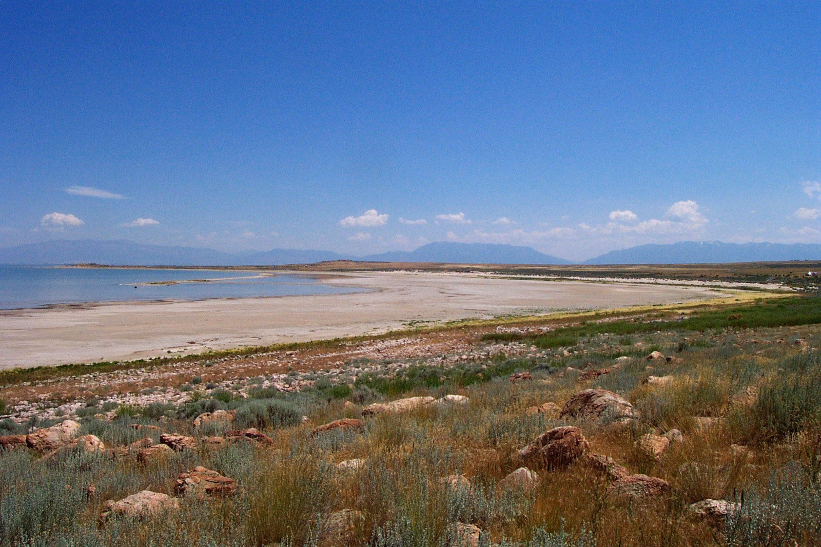 The wide sandy beach and shallow water of Great Salt Lake at Antelope Island State Park