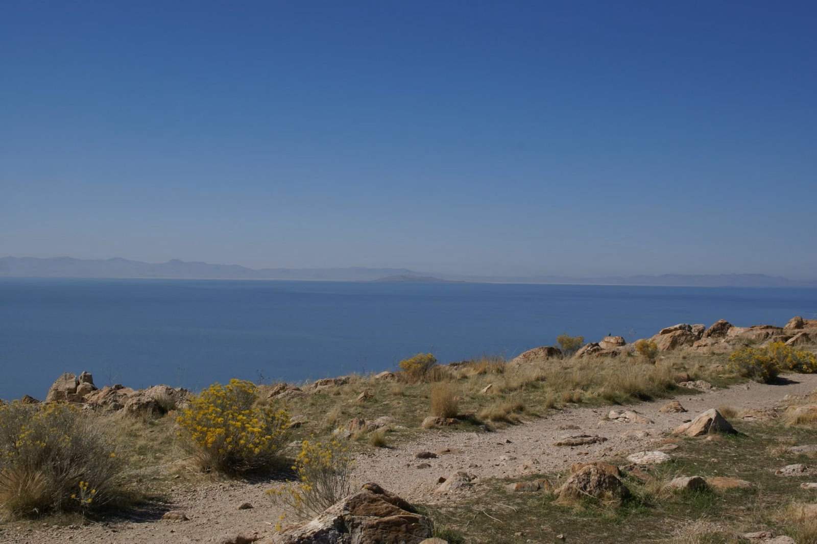 A rocky shrub-covered point above Great Salt Lake on Antelope Island